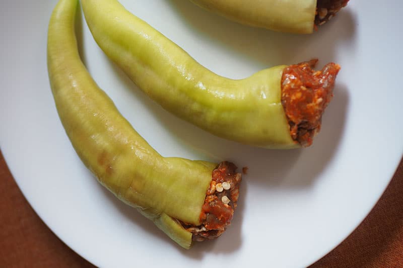 Banana pepper stuffed with raw sausage